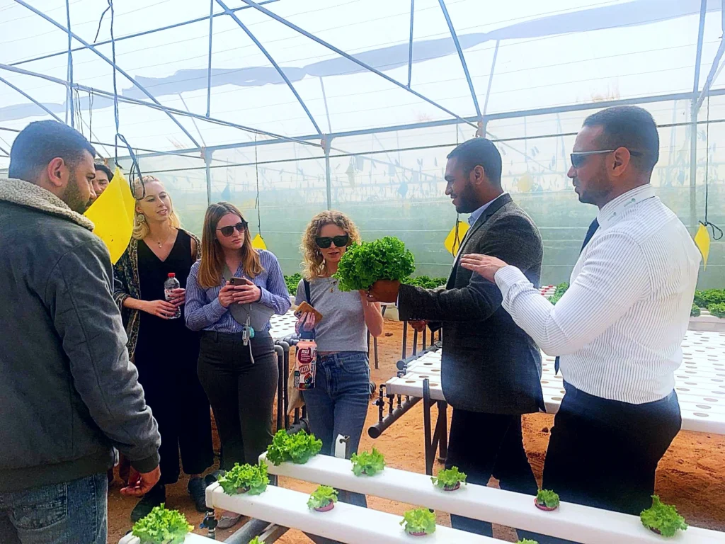 Visitors learning about hydroponic farming at ReNile greenhouse