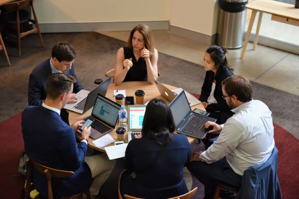 Collaborative Business Team Meeting | Diverse Group with Laptops